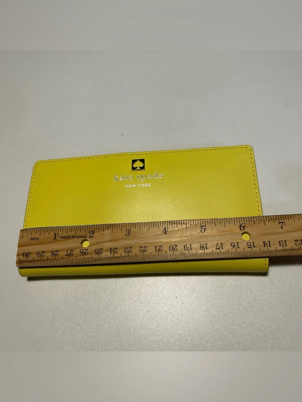 kate spade Yellow Leather Slim Bifold Wallet